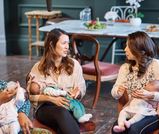Two mums and their babies at a postnatal course